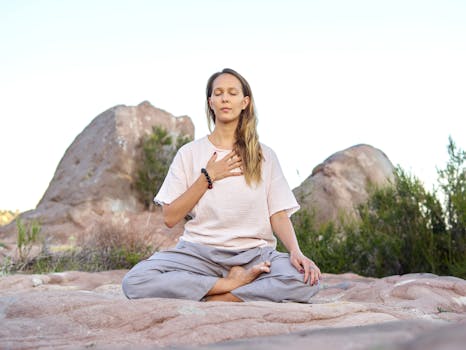 A person practicing yoga in a peaceful outdoor setting