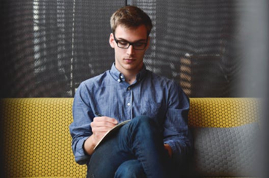 image of a person writing in their journal