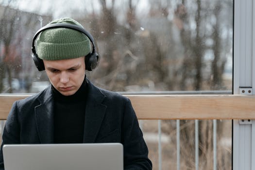 Focused young professional working on a laptop