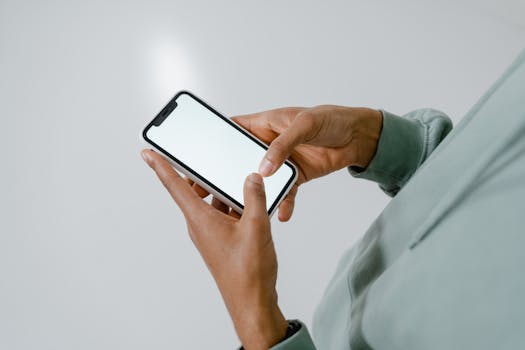 person meditating with app on phone