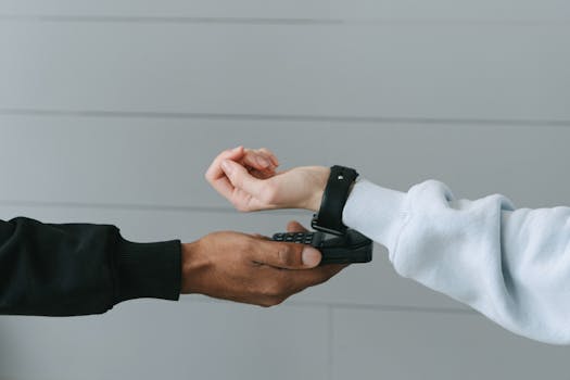 Person using a wearable tech device while meditating